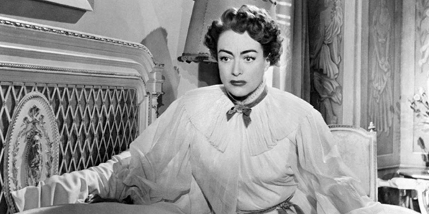 Joan Crawford sitting on her bed in Sudden Fear